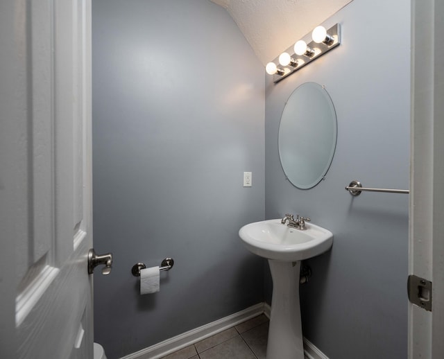 482 Flintlock Ct, Nashville, TN 37217 - half bath featuring tile patterned floors and vaulted ceiling