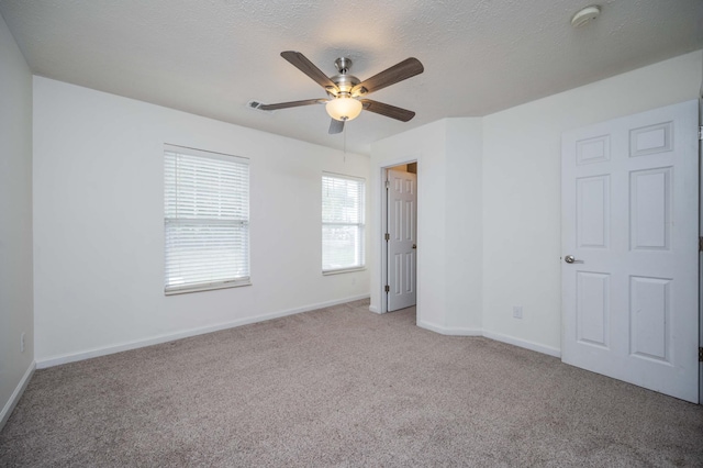 482 Flintlock Ct, Nashville, TN 37217 - unfurnished bedroom with light colored carpet, a textured ceiling, and a ceiling fan