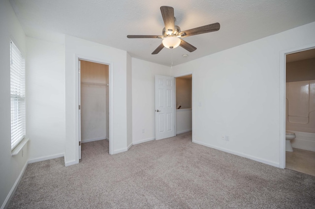 482 Flintlock Ct, Nashville, TN 37217 - unfurnished bedroom with multiple windows, carpet flooring, connected bathroom, and a closet