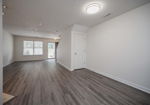 482 Flintlock Ct, Nashville, TN 37217 - unfurnished room with dark wood-style floors and a textured ceiling