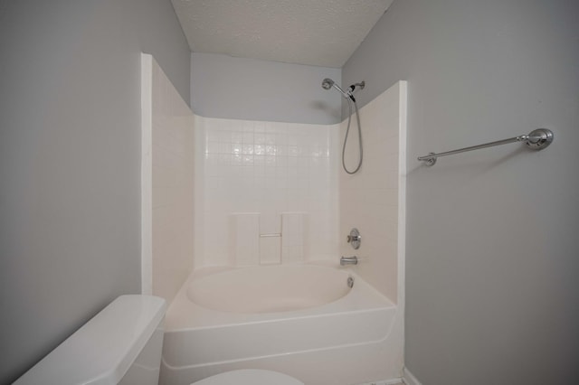 482 Flintlock Ct, Nashville, TN 37217 - bathroom featuring a textured ceiling and tub / shower combination
