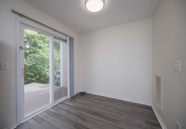 482 Flintlock Ct, Nashville, TN 37217 - spare room with wood finished floors and a textured ceiling
