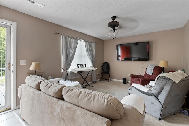 460 E Georgia Ave, Whitwell, TN 37397 - living area featuring light carpet, ceiling fan, and a textured ceiling