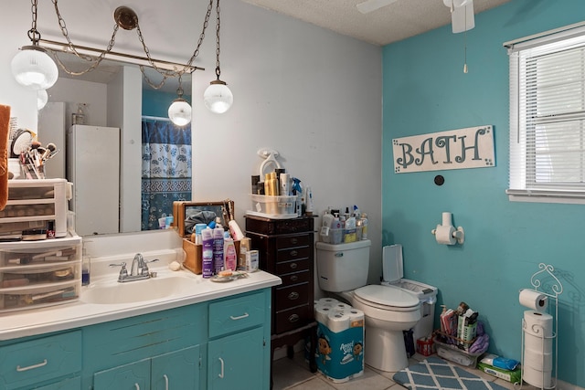 460 E Georgia Ave, Whitwell, TN 37397 - bathroom featuring vanity, a shower, tile patterned floors, and a ceiling fan