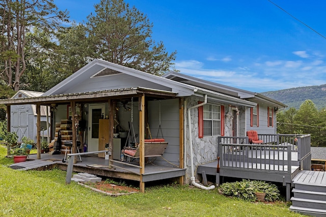 460 E Georgia Ave, Whitwell, TN 37397 - view of front of house with a front lawn and a deck with mountain view