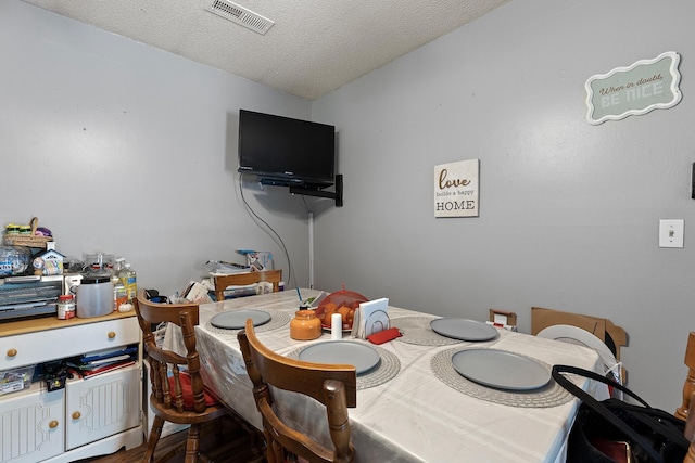 460 E Georgia Ave, Whitwell, TN 37397 - dining area featuring a textured ceiling
