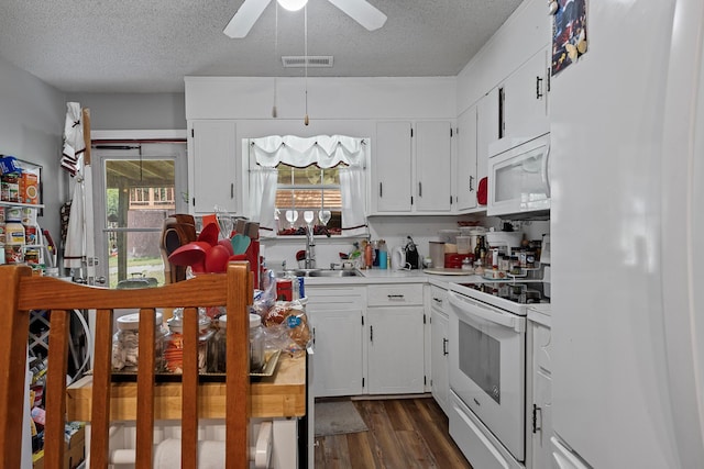 460 E Georgia Ave, Whitwell, TN 37397 - kitchen featuring white appliances, a textured ceiling, a ceiling fan, dark wood-style flooring, and light countertops