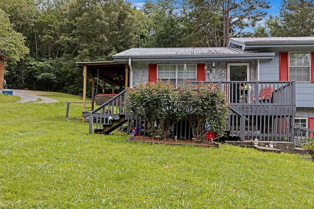 460 E Georgia Ave, Whitwell, TN 37397 - view of front of home featuring stairway, a front yard, covered porch, and a metal roof