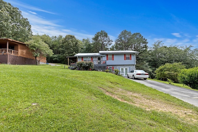 460 E Georgia Ave, Whitwell, TN 37397 - split level home featuring a front yard and asphalt driveway