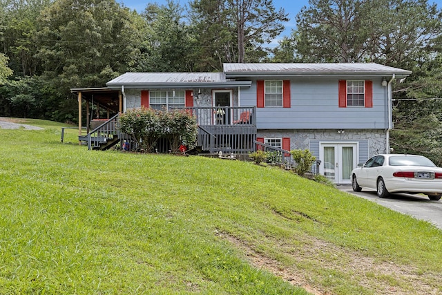460 E Georgia Ave, Whitwell, TN 37397 - split level home featuring a front yard, a metal roof, stairs, french doors, and a porch