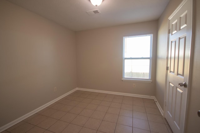 1611 12th Ave N, Nashville, TN 37208 - spare room with baseboards and light tile patterned floors