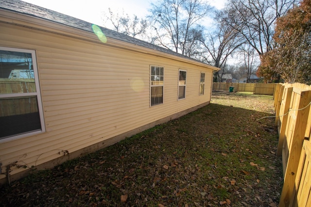 1611 12th Ave N, Nashville, TN 37208 - view of home's exterior featuring a fenced backyard and roof with shingles