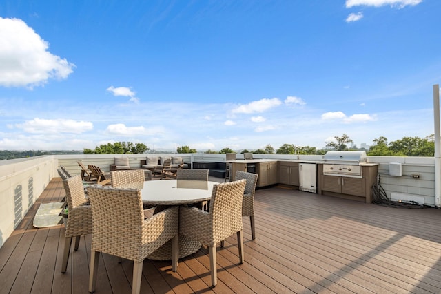 1711 Sevier St, Nashville, TN 37206 - deck with exterior kitchen, outdoor dining space, and an outdoor living space