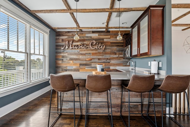 1711 Sevier St, Nashville, TN 37206 - bar with stainless steel microwave, wood walls, coffered ceiling, decorative light fixtures, and dark wood-style flooring