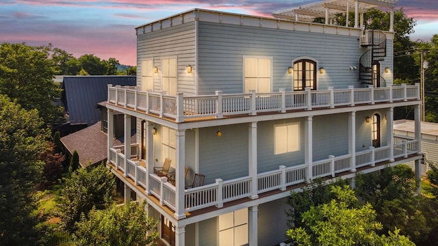 1711 Sevier St, Nashville, TN 37206 - back of property at dusk with a balcony and a pergola
