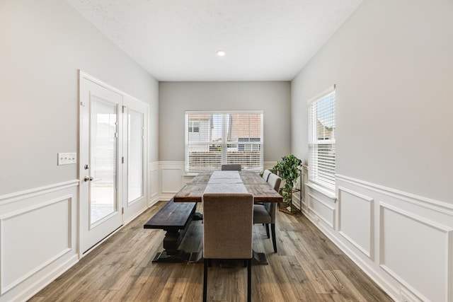 2122 Oak Dr, Murfreesboro, TN 37128 - dining area featuring a decorative wall, wainscoting, wood finished floors, and recessed lighting