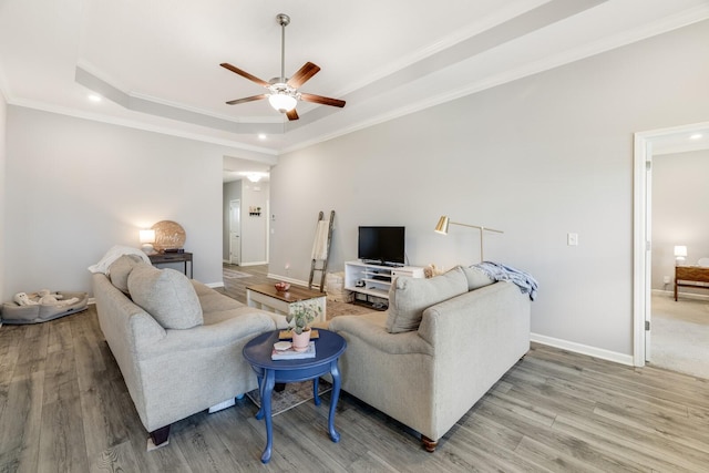 2122 Oak Dr, Murfreesboro, TN 37128 - living area featuring a raised ceiling, ceiling fan, wood finished floors, crown molding, and recessed lighting
