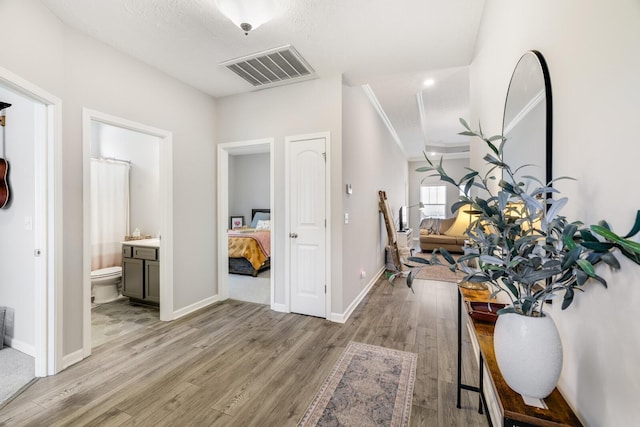 2122 Oak Dr, Murfreesboro, TN 37128 - hallway featuring light wood-style flooring and crown molding