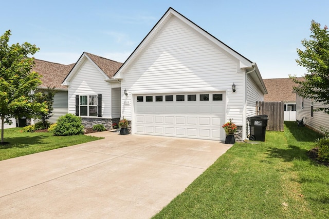 2122 Oak Dr, Murfreesboro, TN 37128 - view of front of home with concrete driveway, a garage, stone siding, and roof with shingles