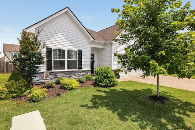 2122 Oak Dr, Murfreesboro, TN 37128 - view of front of home featuring an attached garage, roof with shingles, stone siding, and driveway