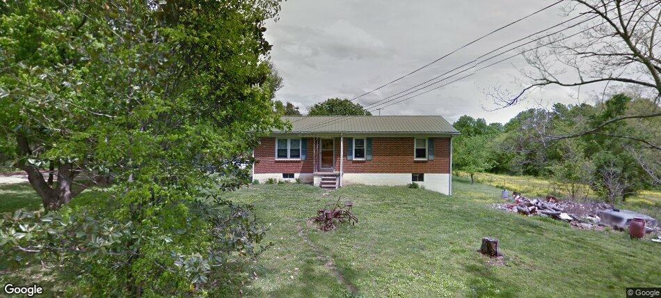 2968 Howard Bridge Rd, Columbia, TN 38401 - rear view of property with a lawn