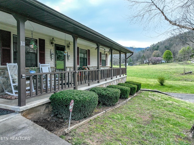 311 E Chestnut Hill Rd, Townsend, TN 37882 - view of exterior entry with covered porch, a lawn, and a mountain view