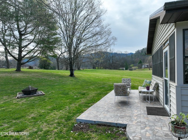 311 E Chestnut Hill Rd, Townsend, TN 37882 - view of grassy yard with an outdoor fire pit, a patio, and a mountain view