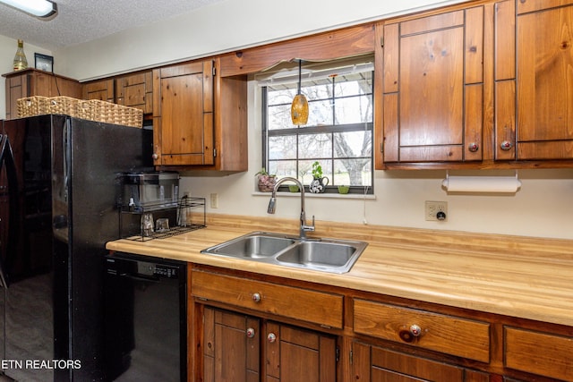 311 E Chestnut Hill Rd, Townsend, TN 37882 - kitchen featuring dishwasher, brown cabinets, a textured ceiling, and wood counters