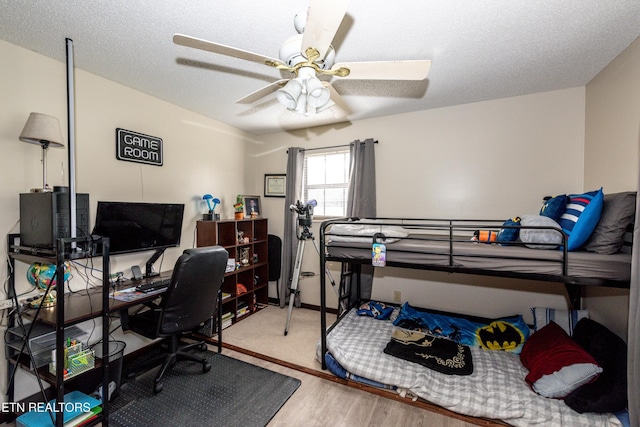 311 E Chestnut Hill Rd, Townsend, TN 37882 - bedroom with a desk, wood finished floors, and ceiling fan