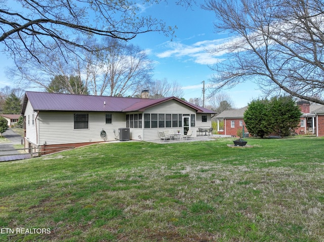 311 E Chestnut Hill Rd, Townsend, TN 37882 - back of property featuring a chimney, a patio area, a yard, and an outdoor fire pit