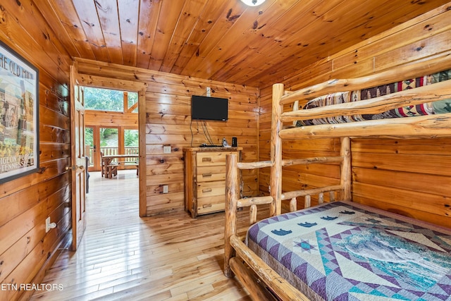 1615 Mountain Dreams Way, Sevierville, TN 37862 - bedroom with wood walls, light wood-style flooring, and wood ceiling