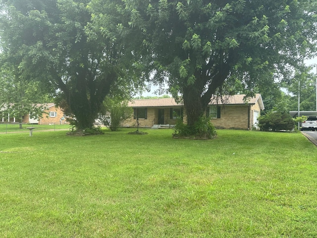 233 Flat Ridge Rd, Goodlettsville, TN 37072 - view of green lawn with a garage