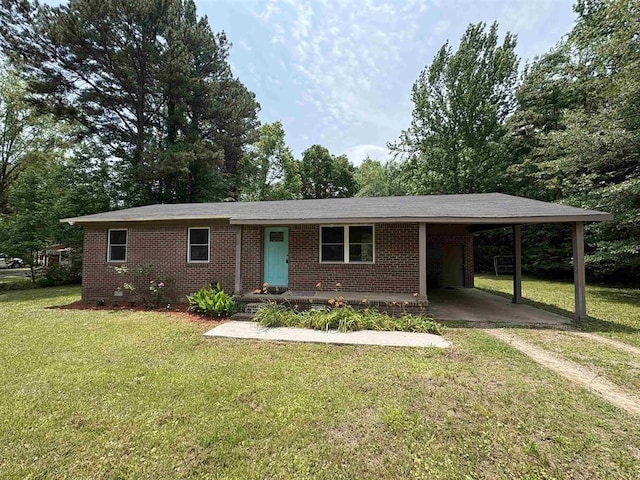 265 Garey Loop Unit 11, Savannah, TN 38372 - single story home featuring dirt driveway, a carport, brick siding, and a front lawn