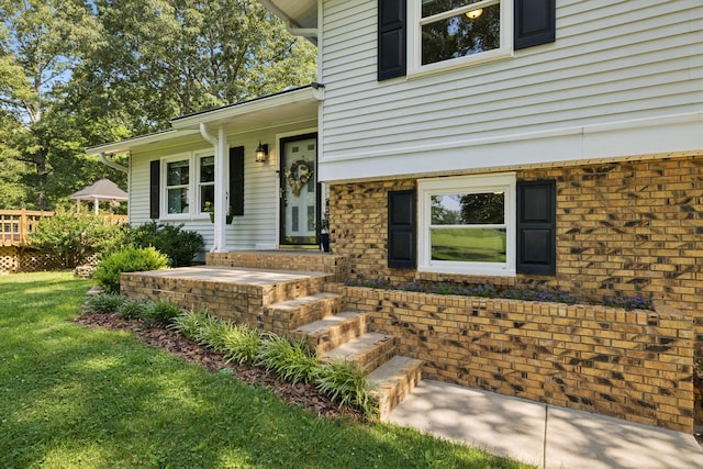 7180 Elrod Rd, Fairview, TN 37062 - entrance to property with brick siding, a lawn, and covered porch