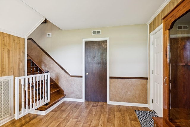 7180 Elrod Rd, Fairview, TN 37062 - entryway featuring wood finished floors, stairs, and wainscoting