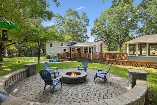 7180 Elrod Rd, Fairview, TN 37062 - view of patio with an outdoor fire pit and a deck