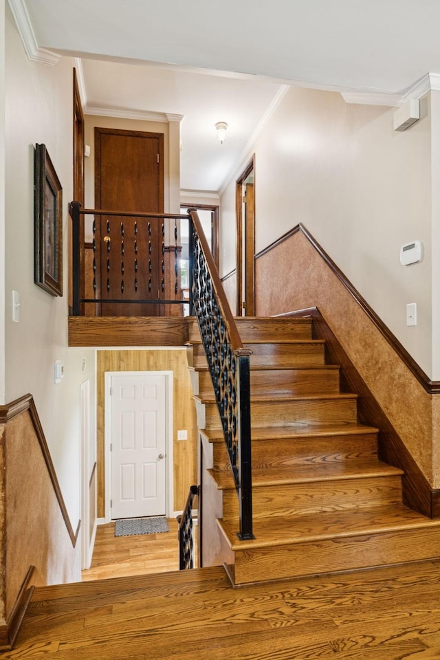 7180 Elrod Rd, Fairview, TN 37062 - staircase with ornamental molding and wood finished floors