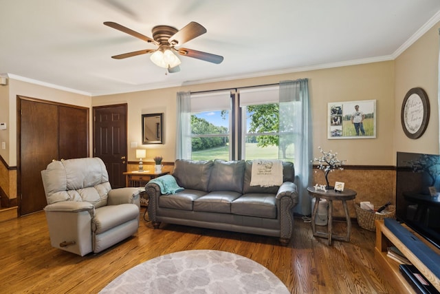 7180 Elrod Rd, Fairview, TN 37062 - living room featuring ceiling fan, crown molding, wood finished floors, and a wainscoted wall