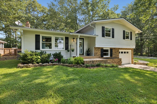 7180 Elrod Rd, Fairview, TN 37062 - split level home featuring a chimney, driveway, an attached garage, a front yard, and brick siding