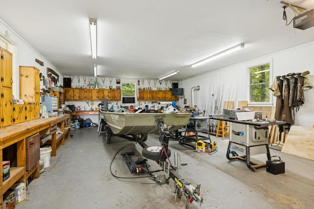 7180 Elrod Rd, Fairview, TN 37062 - garage with a workshop area and a garage door opener