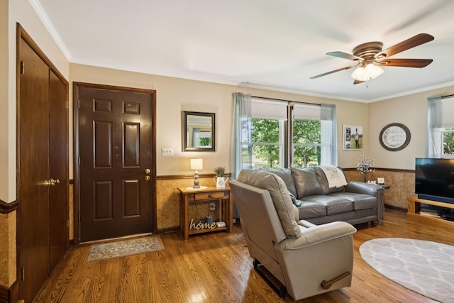 7180 Elrod Rd, Fairview, TN 37062 - living room featuring a wainscoted wall, plenty of natural light, wood finished floors, a ceiling fan, and crown molding