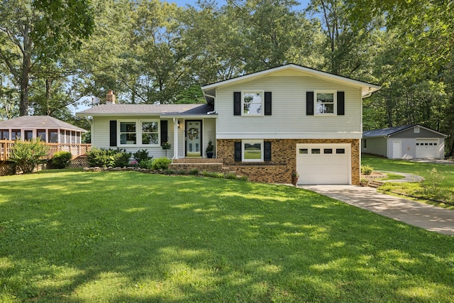 7180 Elrod Rd, Fairview, TN 37062 - split level home with an attached garage, concrete driveway, a front yard, a chimney, and brick siding
