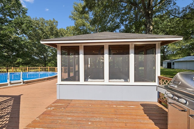 7180 Elrod Rd, Fairview, TN 37062 - wooden deck with a sunroom and a grill