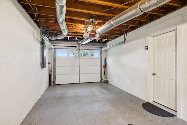 7180 Elrod Rd, Fairview, TN 37062 - garage with a garage door opener, concrete block wall, and electric panel