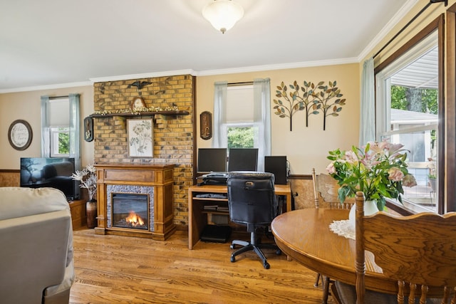 7180 Elrod Rd, Fairview, TN 37062 - home office with wood finished floors, a brick fireplace, and ornamental molding