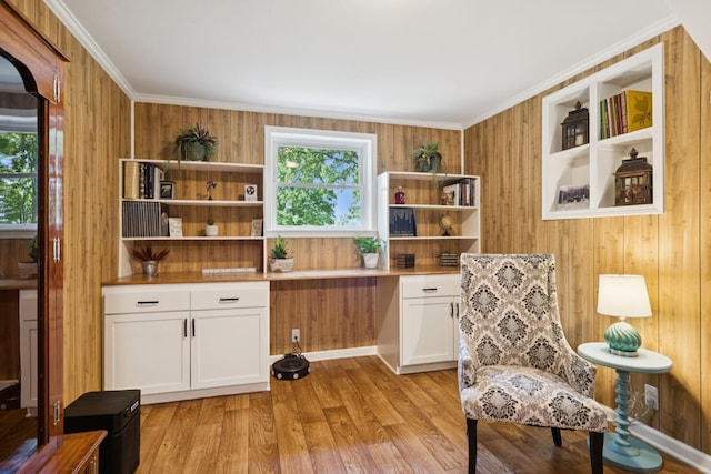 7180 Elrod Rd, Fairview, TN 37062 - living area with plenty of natural light, wooden walls, light wood-type flooring, and ornamental molding