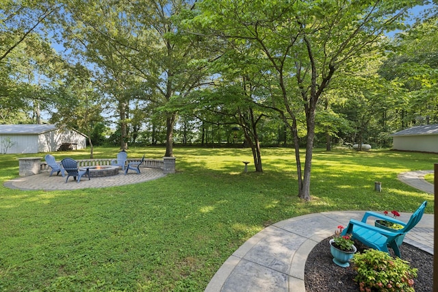 7180 Elrod Rd, Fairview, TN 37062 - view of grassy yard featuring an outdoor fire pit and a patio