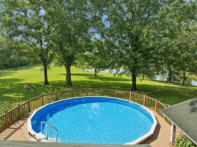 7180 Elrod Rd, Fairview, TN 37062 - view of swimming pool with a wooden deck and a lawn