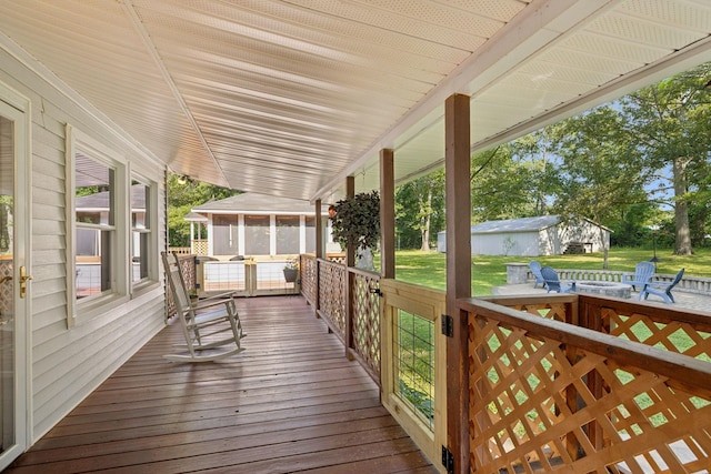 7180 Elrod Rd, Fairview, TN 37062 - wooden deck featuring a sunroom and a lawn