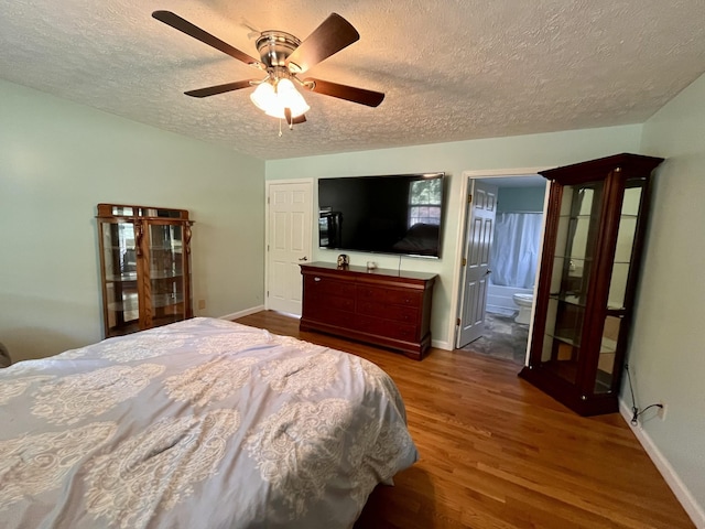 4038 Mount Zion Rd, Morrison, TN 37357 - bedroom featuring a textured ceiling, wood finished floors, ceiling fan, and ensuite bath